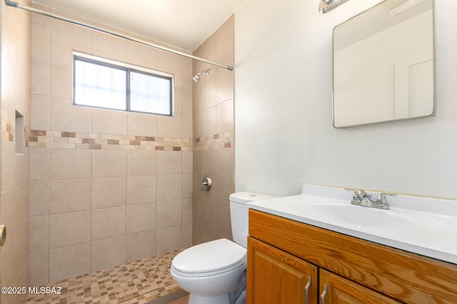 858 W Calle Evelina, Tucson, AZ 85706 - bathroom with a tile shower, vanity, and toilet
