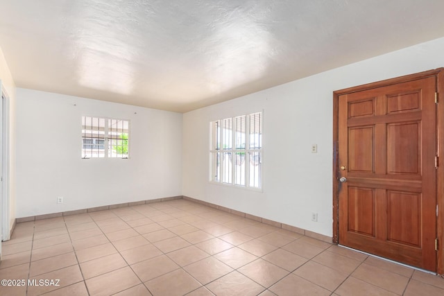 858 W Calle Evelina, Tucson, AZ 85706 - tiled spare room featuring plenty of natural light
