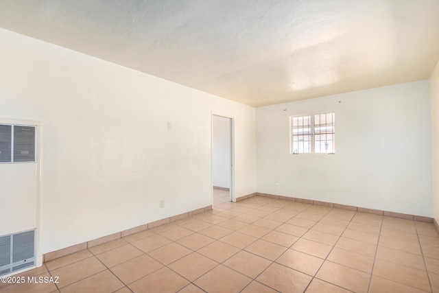 858 W Calle Evelina, Tucson, AZ 85706 - empty room with light tile patterned floors