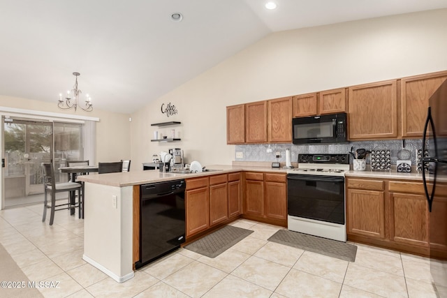 kitchen featuring hanging light fixtures, an inviting chandelier, decorative backsplash, light tile patterned floors, and black appliances