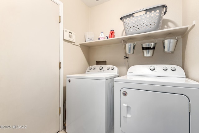 laundry area with washing machine and clothes dryer