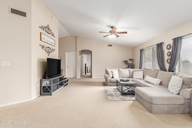 living room with carpet, ceiling fan, and vaulted ceiling