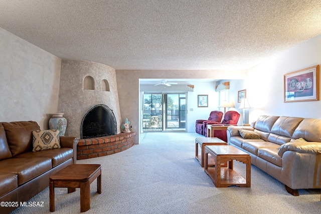 living room featuring carpet flooring, a brick fireplace, and a textured ceiling