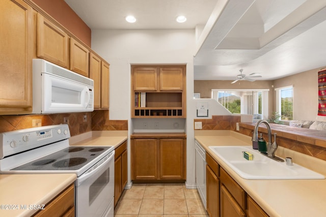 kitchen with ceiling fan, sink, light tile patterned flooring, and white appliances