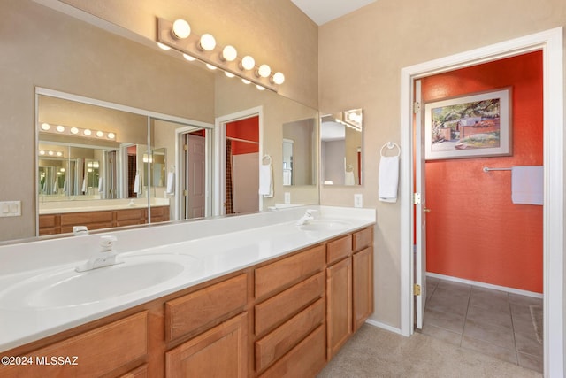 bathroom featuring tile patterned flooring and vanity