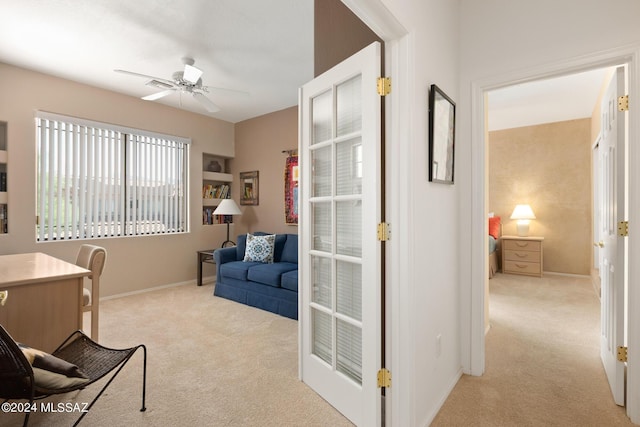 office featuring ceiling fan and light colored carpet