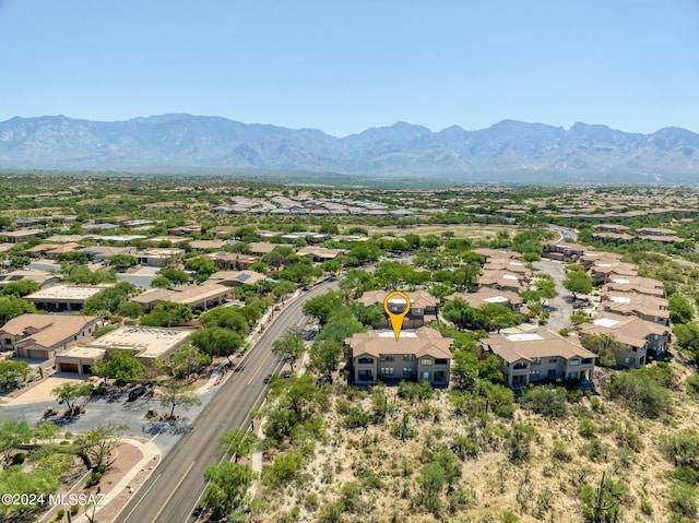 birds eye view of property featuring a mountain view