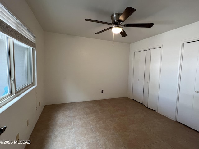 unfurnished bedroom with ceiling fan