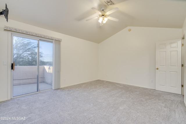 interior space with ceiling fan, light colored carpet, and lofted ceiling