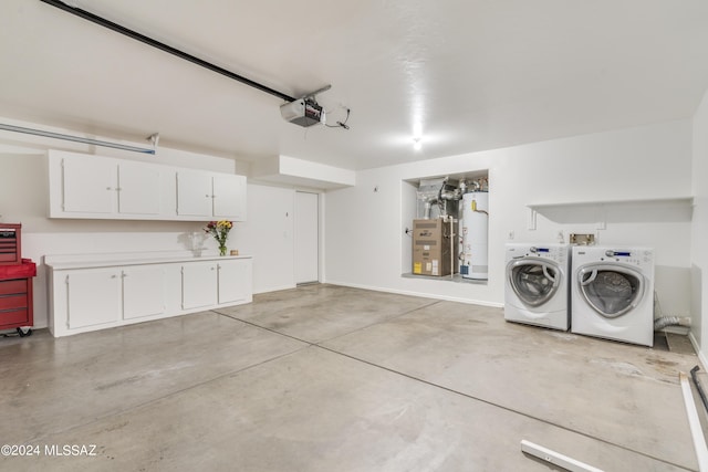 garage featuring heating unit, washer and dryer, gas water heater, and a garage door opener