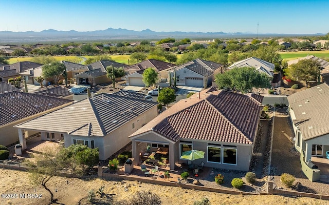 birds eye view of property with a mountain view