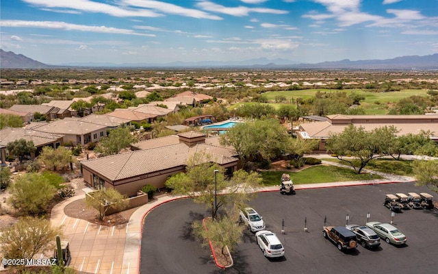 birds eye view of property with a mountain view