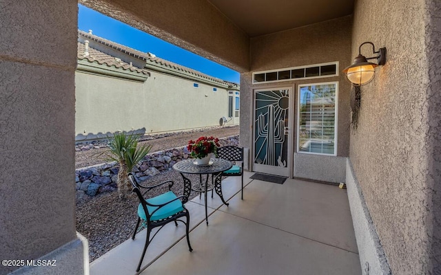 property entrance with a patio area