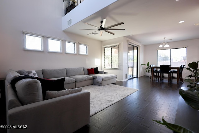 living area featuring baseboards, visible vents, a ceiling fan, dark wood-type flooring, and recessed lighting