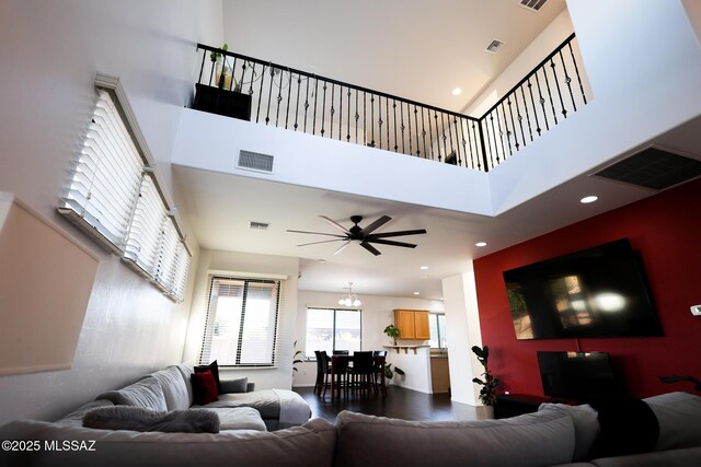 bedroom featuring ceiling fan and dark carpet