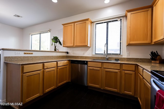 kitchen with visible vents, a sink, stainless steel dishwasher, a peninsula, and range