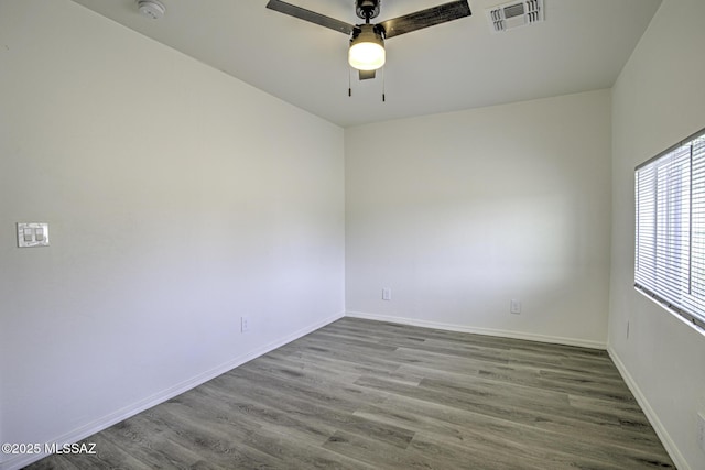 spare room featuring hardwood / wood-style floors and ceiling fan