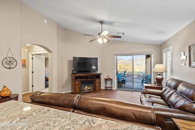 living room with vaulted ceiling and ceiling fan