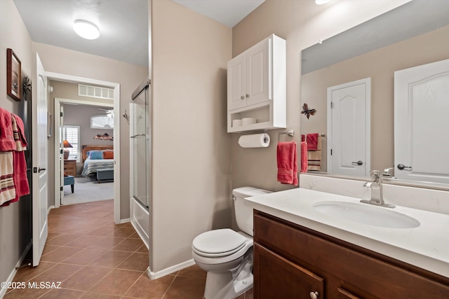 full bathroom featuring combined bath / shower with glass door, toilet, tile patterned floors, and vanity