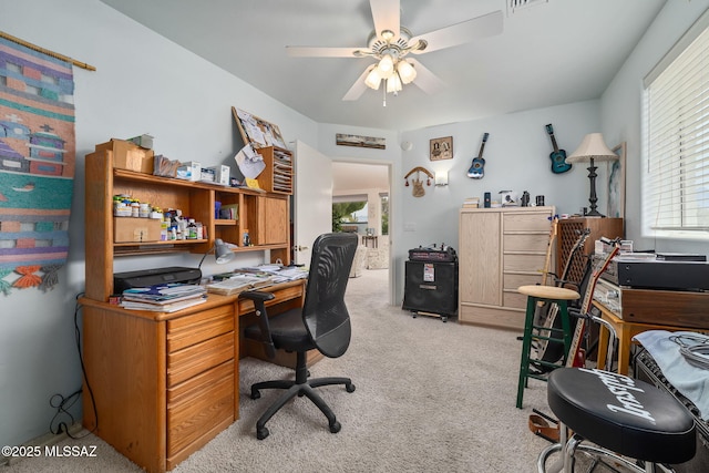 office with light colored carpet, a wealth of natural light, and ceiling fan