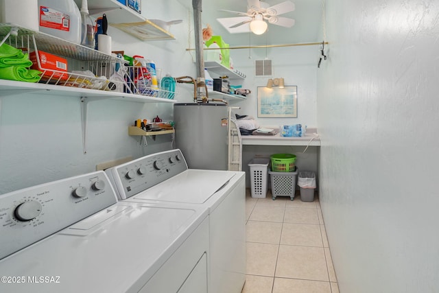 laundry room with ceiling fan, gas water heater, separate washer and dryer, and light tile patterned floors