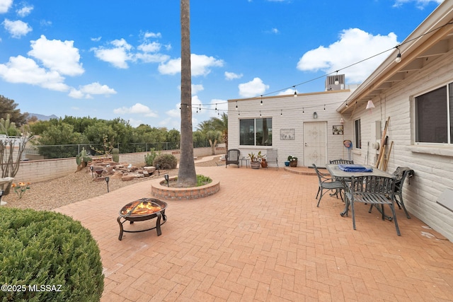 view of patio featuring a fire pit