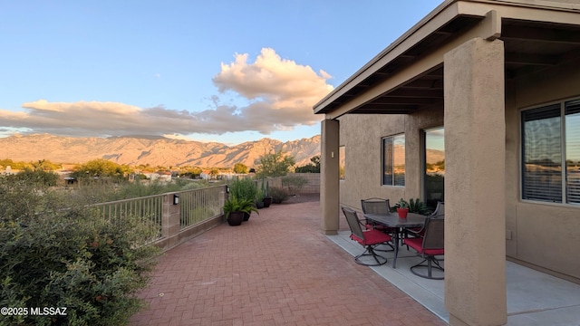 view of patio / terrace featuring a mountain view