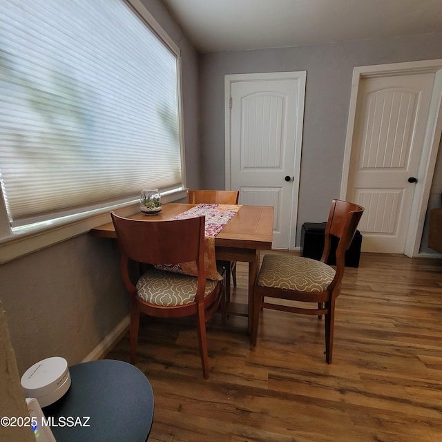 dining space featuring dark hardwood / wood-style floors