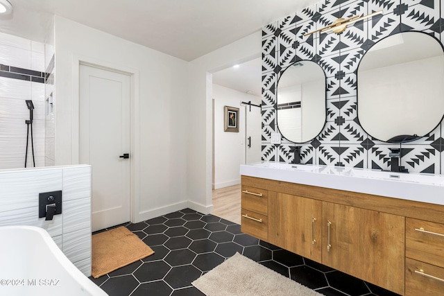 bathroom with a tub to relax in and vanity