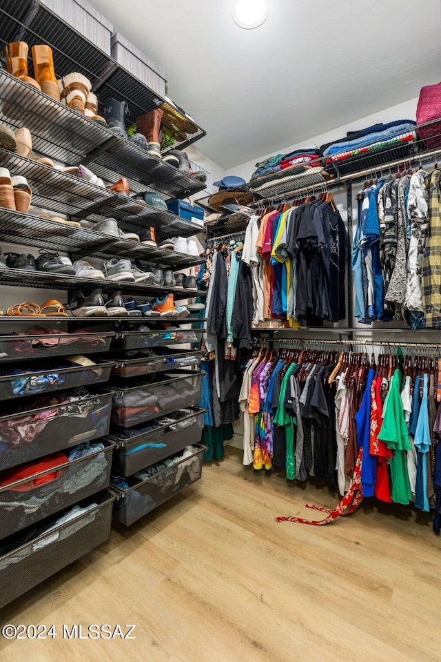 walk in closet featuring light hardwood / wood-style flooring