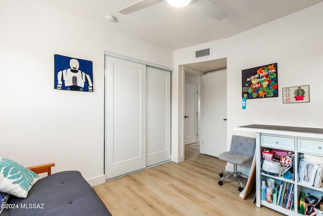 office with ceiling fan and light wood-type flooring