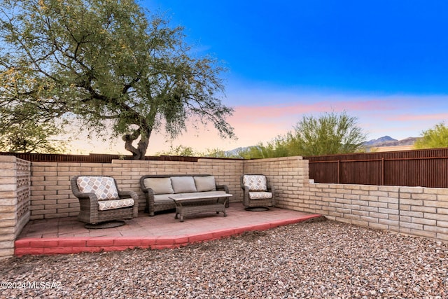 yard at dusk with a patio area