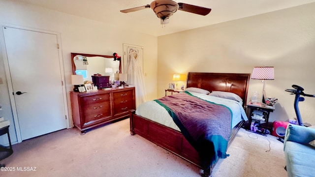 bedroom featuring ceiling fan and carpet