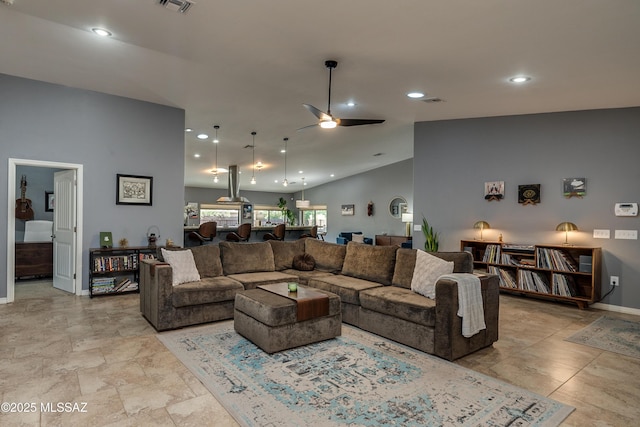 living room featuring ceiling fan and high vaulted ceiling