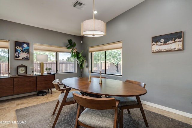 dining area with lofted ceiling