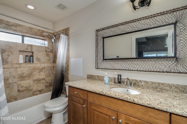 full bathroom with toilet, shower / bath combo with shower curtain, and vanity