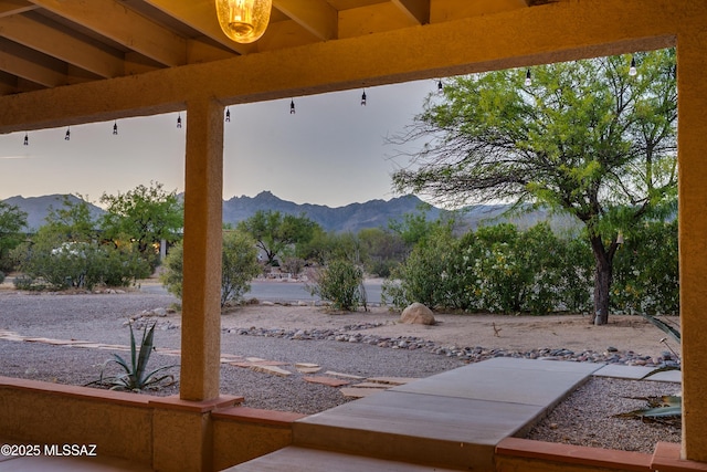 view of patio / terrace with a mountain view