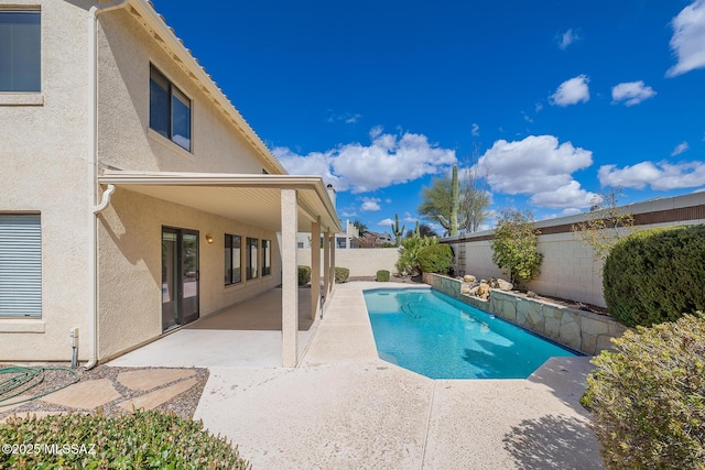 view of pool with a patio area, a fenced in pool, and a fenced backyard