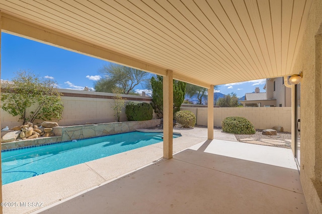 view of pool with a fenced in pool, a patio, and a fenced backyard