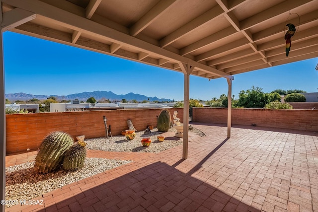 view of patio / terrace with a mountain view