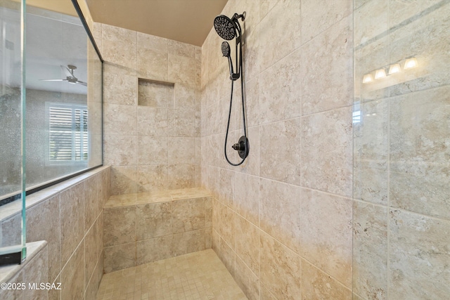 bathroom with a tile shower and ceiling fan