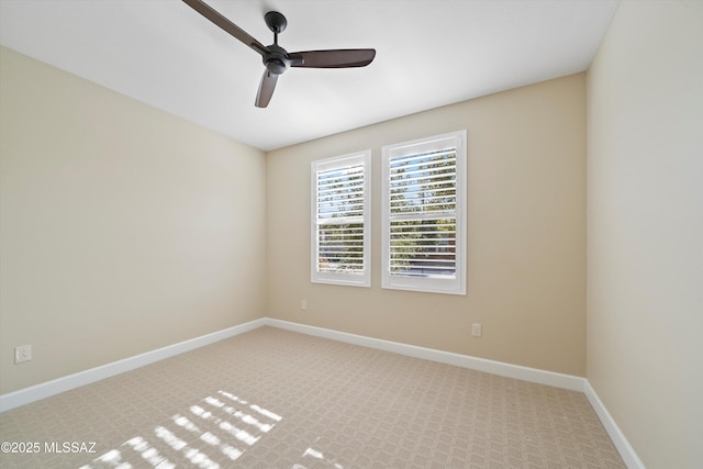 unfurnished room featuring ceiling fan, carpet, and baseboards