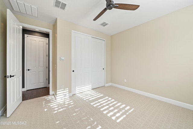 unfurnished bedroom featuring visible vents and carpet flooring