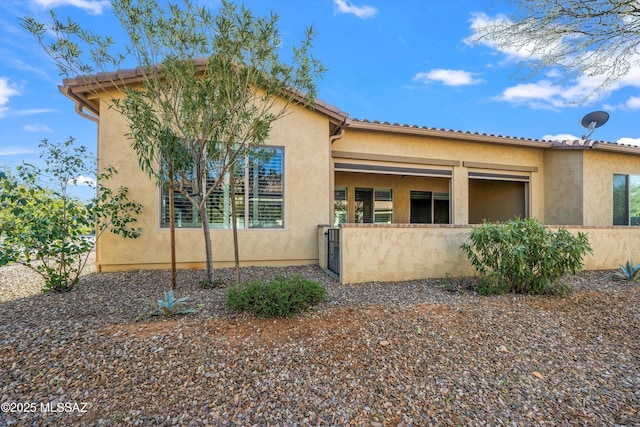 exterior space featuring stucco siding