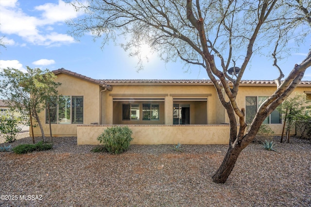 view of side of home featuring stucco siding