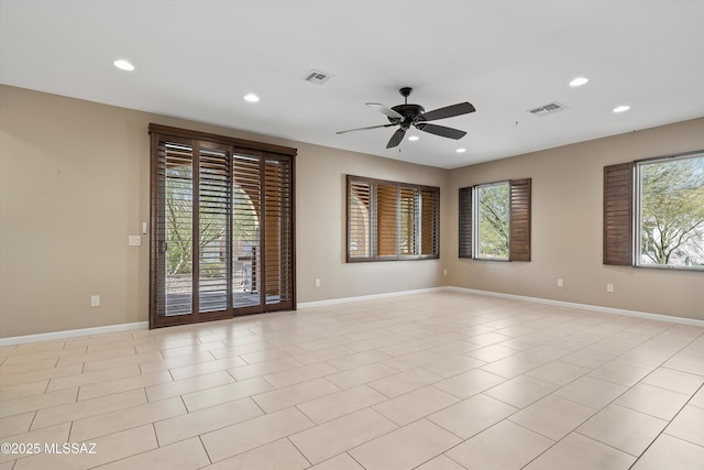 empty room with light tile patterned flooring and ceiling fan