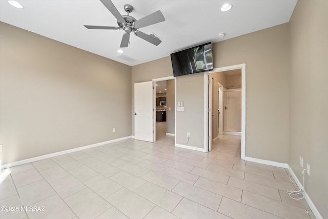 unfurnished bedroom with light tile patterned flooring and ceiling fan