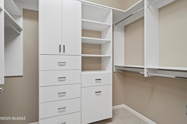 walk in closet featuring light tile patterned floors