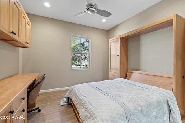 bedroom featuring light hardwood / wood-style flooring and ceiling fan