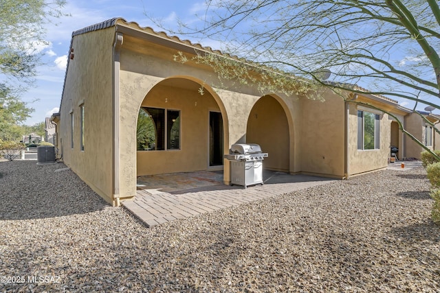 back of house featuring a patio area